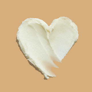 Top view of shea butter in a shape of heart 