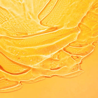 Top view of vitamine E liquid in an orange background